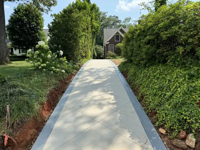 A concrete sidewalk and walkway poured by Ace Concrete Construction