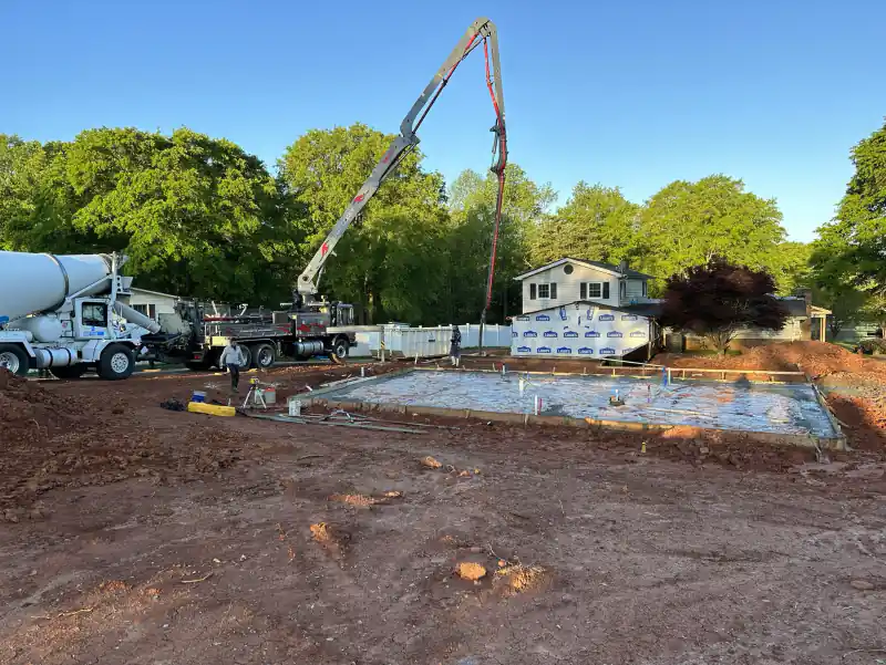 An Ace Concrete Construction work truck on a job site
