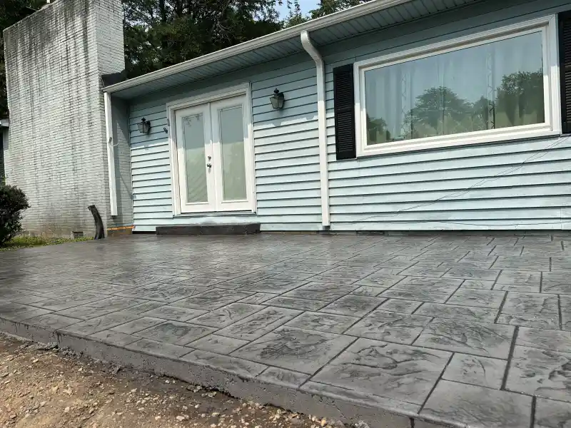 A stamped concrete surface bordered by a contrasting banded edge.