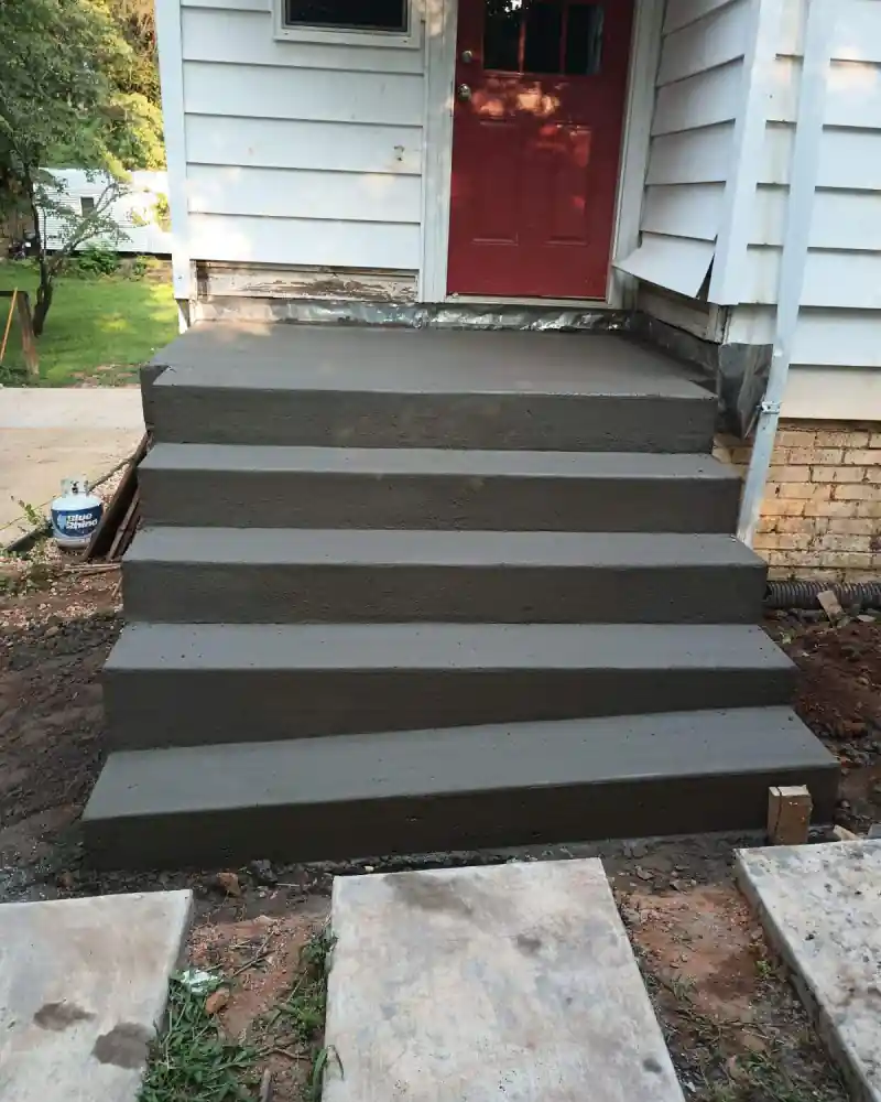 A concrete patio and outdoor living area poured by Ace Concrete Construction